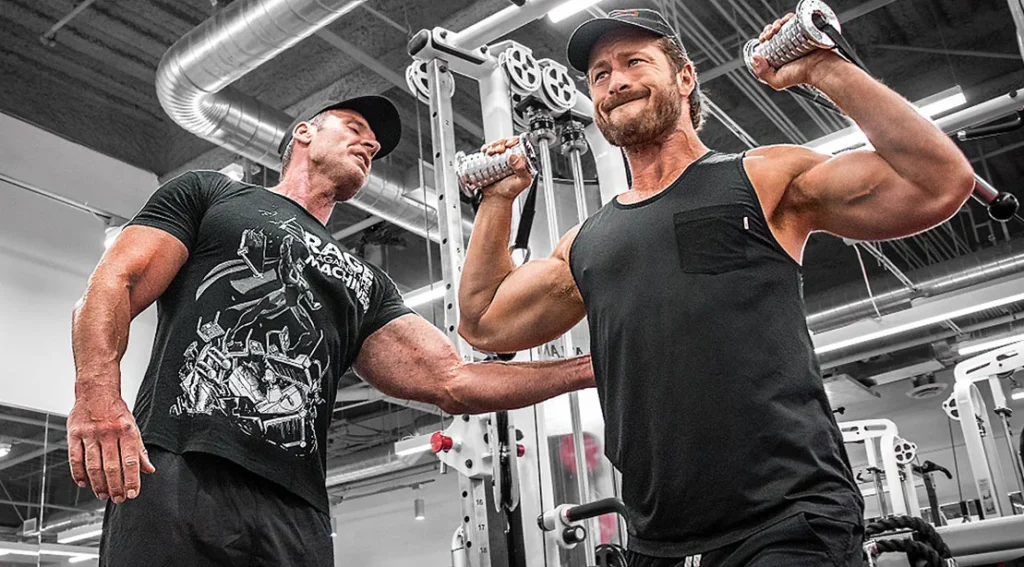 How to Build Muscle Faster: Proven Techniques Used by Professional Coaches Current image: nick mitchell training actor glen powell copy